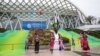 Dancers perform outside the venue of the UN Biodiversity Conference (COP 15) in Kunming, in China's southwestern Yunnan province on Oct. 11, 2021. 