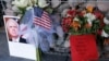 A makeshift memorial builds at the office of Arizona Republican Sen. John McCain, Aug. 26, 2018, in Phoenix. 