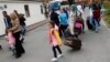 FILE - Syrian refugees arrive at the camp for refugees and migrants in Friedland, Germany, April 4, 2016.