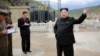 North Korean leader Kim Jong Un (R) gives field guidance during a visit to a construction site in this undated photo released by North Korea's Korean Central News Agency (KCNA) in Pyongyang, Sept. 14, 2015.