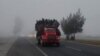 FILE - Migrants ride in the back of a truck during their journey toward the United States, in Los Olivos, Mexico, Feb. 2, 2019. On Thursday dozens of migrants were killed or injured when the truck they were riding in crashed in Mexico.