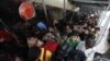People from India's northeastern states crowd a railway station after disembarking a train from the southern Bangalore city in Gauhati, Assam State, India, August 20, 2012.