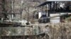 A South Korean soldier takes a rest as he leans on a moblie artillery vehicle at a training field near the demilitarized zone separating the two Koreas in Paju, South Korea, Jan. 7, 2016.