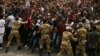 FILE -- Demonstrators chant slogans and flash the Oromo protest gesture during Irreecha, the thanksgiving festival of the Oromo people, in Bishoftu town, Oromia region, Ethiopia. 