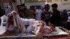 Pakistan volunteers rush an injured person to a hospital in Quetta, Pakistan, Aug. 16, 2019. 