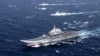 FILE - China's Liaoning aircraft carrier with accompanying fleet conducts a drill in an area of South China Sea, in this photo taken December 2016.