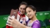 Lee Eun-Ju of South Korea, right, takes a selfie picture with Hong Un Jong of North Korea.