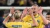 Ukraine's midfielder #10 Mykhaylo Mudryk and Ukraine's defender #04 Maksym Talovierov celebrate after the UEFA's EURO 2024 qualification final play off football match between Ukraine and Iceland, in Wroclaw, Poland, on March 26, 2024.