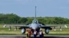 Taiwan Air Force staffers salute in front of an upgraded US-made F-16 V fighter during a ceremony at the Chiayi Air Force in southern Taiwan on Nov. 18, 2021. 