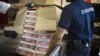 FILE - Seized cigarettes are pictured before being destroyed by French customs July 8, 2010, in Dijon, eastern France. 