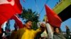 Members of the splinter faction of the Unified Communist Party of Nepal Maoist shout slogans during a general strike called by the party against the decision to form an interim government led by the Supreme Court chief justice in Katmandu, Nepal, February