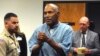 FILE - Former pro football star O.J. Simpson reacts after learning he was granted parole, at Lovelock Correctional Center in Lovelock, Nevada, July 20, 2017. 