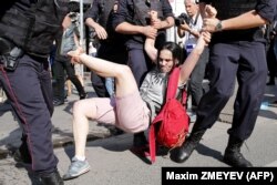 RUSSIA – Police officers detain people during an rally in the center of Moscow, July 27, 2019