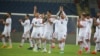 Iran's players acknowledge their supporters following a friendly soccer match between Turkey and Iran, in Istanbul, May 28, 2018. The world's largest footwear maker, Nike, says it cannot provide shoes for the Iranian team because of the Trump administration's plan to re-impose U.S. sanctions on Iran.