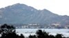 FILE - Vietnam Navy ships barely visible inside Cam Ranh Bay (D. Schearf/VOA).