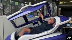 FILE - Australian euthanasia advocate Philip Nitschke demonstrates the Sarco assisted suicide capsule during a press conference organized by The Last Resort, a human rights group focused on assisted suicide, in Zurich, Switzerland, on July 17, 2024.