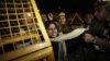 Indian women demonstrating against the brutal gang-rape of a woman on a moving bus scuffle with police as they try to approach the residence of Indian Home Minister Sushilkumar Shinde in New Delhi, India, Dec. 24, 2012.