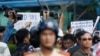 Protesters holding placards which read, "Haiyang 981 oil rig get out of Vietnam (L)" and "Take China to the international court" (R) as they march during an anti-China protest in Vietnam's southern Ho Chi Minh city May 18, 2014.