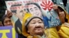 FILE - Former comfort woman Kil Un-ock, forced into sexual slavery to Japanese troops during World War II, attends a rally protesting a U.S. visit by Japanese Prime Minster Shinzo Abe, outside the Japanese Embassy in Seoul.