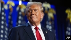 FILE - Donald Trump arrives at an election night watch party at the Palm Beach Convention Center in West Palm Beach, Florida, Nov. 6, 2024.