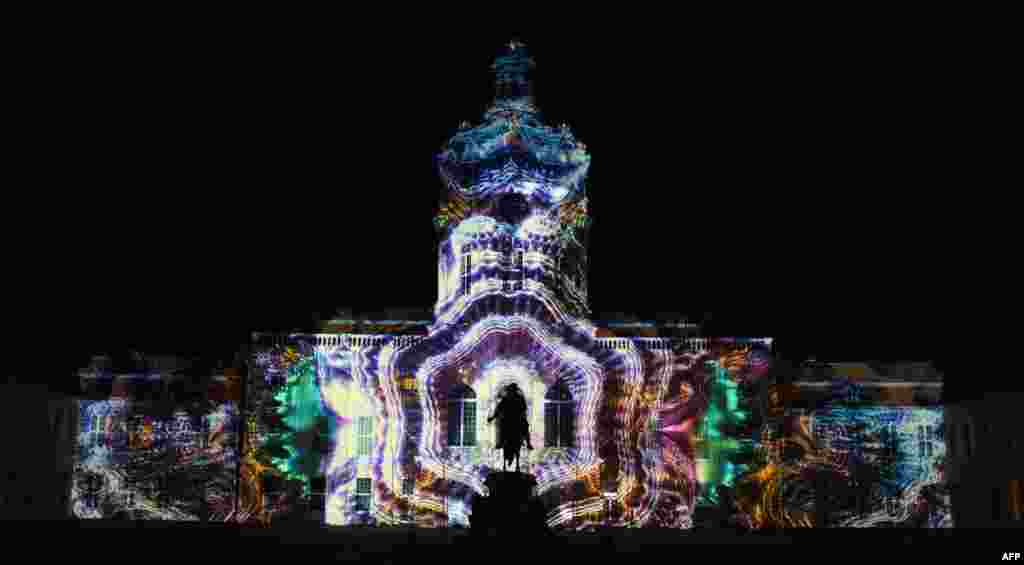 Colourful designs are projected on the facade of the Charlottenburg Palace as part of the yearly Festival of Lights in Berlin, Germany, Sept. 14, 2020.