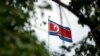 FILE - The North Korean flag flies above the North Korean Embassy in Beijing, April 20, 2017. The South Korean news agency says North Korea has detained a third U.S. citizen.