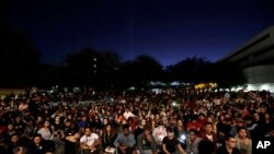 Students from University of Nevada Las Vegas hold a vigil Oct. 2, 2017, in Las Vegas. 