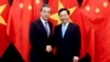 Chinese Foreign Minister Wang Yi, left and Vietnamese Foreign Minister Pham Binh Minh shake hands in Hanoi, Vietnam, April 1, 2018.