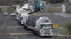 South Korean vehicles returning from North Korea's joint Kaesong Industrial Complex pass the customs, immigration and quarantine office near the border village of Panmunjom, in Paju, South Korea, Feb. 11, 2016.