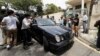 Media chases a car which came out from North Korean Embassy in Kuala Lumpur, Malaysia, Feb. 22, 2017. 
