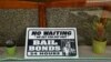 FILE - A sign is seen in the window of a bail bonds office across from the Hall of Justice in San Francisco, Dec. 23, 2015.