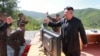 FILE - North Korean Leader Kim Jong Un reacts during the test-firing of an intercontinental ballistic missile in a photo released by North Korea's Korean Central News Agency (KCNA), in Pyongyang, July, 4 2017.