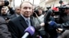 FILE - Ukrainian ex-president Leonid Kuchma, surrounded by journalists, in Kyiv.
