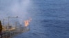 Flames are seen at a drilling platform for combustible ice after a completion of a 60-day mining trail in the Shenhu area of South China Sea, southeast of Zhuhai, Guangdong province, China, July 9, 2017