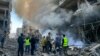 Petugas damkar berupaya memadamkan api di lokasi serangan udara Israel di lingkungan Ghobeiry di pinggiran selatan Beirut pada 15 November 2024.