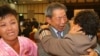 South Korean Min Ho-Sik, center, 84, hugs his North Korean relative Min Eun-Sik, right, 81, during a reunion meeting of family members separated after the Korean War at the Mount Kumgang resort on the North's southeastern coast, Oct. 20, 2015. 