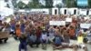 This file photo made from Australia Broadcasting Corporation video taken shows asylum seekers during a sit-in protest at their detention center on Manus Island, Papua New Guinea, Oct. 31, 2017.