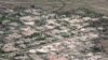 FILE - An aerial view shows burned down villages once inhabited by the Rohingya seen from the Myanmar military helicopters that carried the U.N. envoys to northern Rakhine state, Myanmar, May 1, 2018.