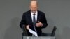 German Chancellor Olaf Scholz speaks during a plenary session at the German parliament before facing a no-confidence vote, in Berlin, Germany, Dec. 16, 2024.
