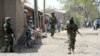 Nigerian soldiers are seen patrolling a town in the north-eastern state of Borno in this April 30, 2013, file photo.