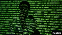 An illustration picture shows a projection of binary code including cyrillic words onto a man, taken in Warsaw October 8, 2014. 