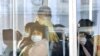 Passengers wear masks inside a trolley bus in Pyongyang, North Korea, Feb. 22, 2020, and released by Kyodo, Feb. 23, 2020.