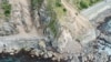 Landslides block State Highway One near Kaikoura on the upper east coast of New Zealand's South Island following an earthquake, Nov. 14, 2016.