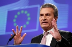 EU Budget and Human Resources Commissioner Gunther Oettinger addresses a news conference in Brussels, Belgium Jan. 10, 2018.