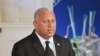 FILE - Fiji's leader Frank Bainimarama comments on how the country's constitution enshrines principles including an independent judiciary, a secular state, and a range of civil, political, and socio-economic rights, during a speech in Suva, Sept. 6, 2013.