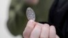 Hunter Kimbel, 7, holds a souvenir penny at the American Dream Mall, March 2, 2025, in East Rutherford, N.J.