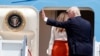 President Donald Trump, accompanied by first lady Melania Trump, waves as they board Air Force One at Andrews Air Force Base, Maryland, May 19, 2017, prior to his departure on his first overseas trip as president.