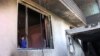 An Afghan boy is seen inside a burnt building after a Taliban attack in Ghazni city, Afghanistan, Aug. 15, 2018. 