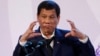 FILE - Philippines' President Rodrigo Duterte gestures during a news conference on the sidelines of the Association of South East Asian Nations summit in Pasay, metro Manila, Philippines, Nov. 14, 2017. 
