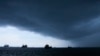 ARCHIVO - Una tormenta asoma en el horizonte de la bahía del Canal de Panamá el 4 de septiembre de 2023 en medio de una prolongada sequía que redujo el caudal del canal y obligó a reducir drásticamente el tránsito marítmo afectando el comercio mundial.